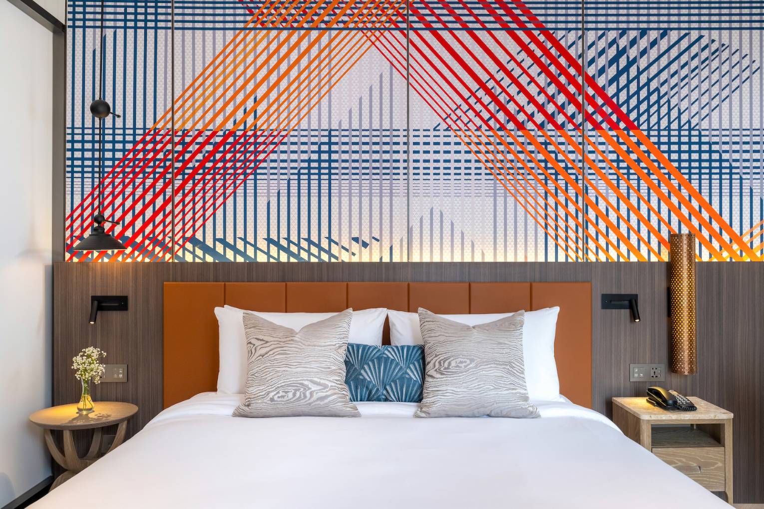 Privilege Room bed with colourful headboard design